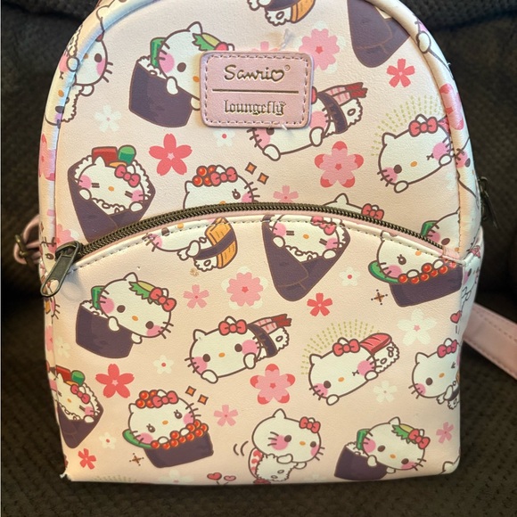 Loungefly Handbags - Loungefly Cream and Pink Hello Kitty Floral mini Backpack Sanrio